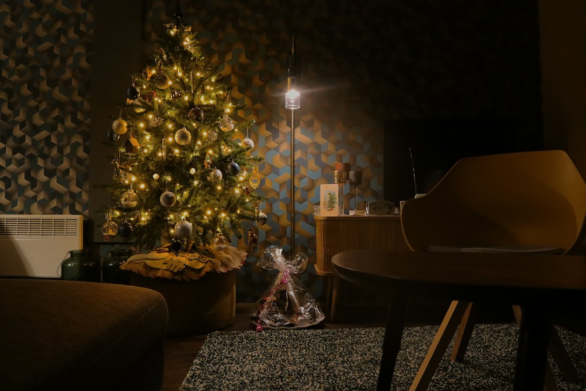 A warmly decorated living room with a Christmas tree